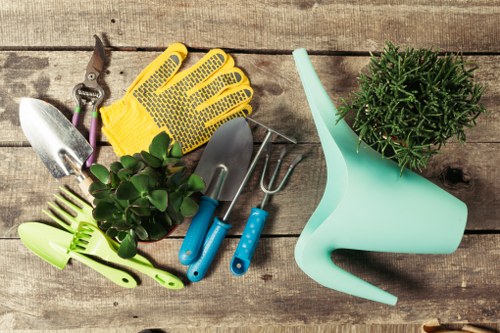 Team members preparing tools and PPE at the start of a garden maintenance job