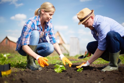 Operator using appropriate protective equipment while handling garden chemicals